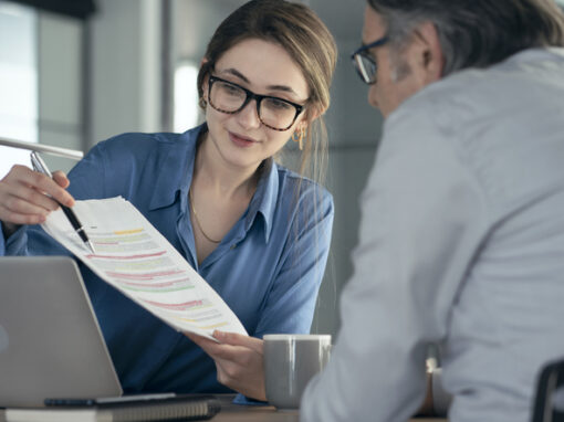An assistant presents a project to her manager